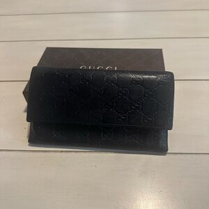 Gucci brown leather trifold wallet